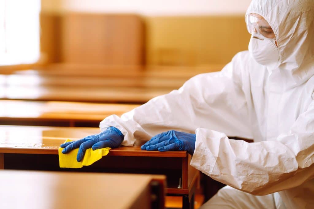 Cleaning and disinfection school desk during coronavirus pandemic. COVID-19.