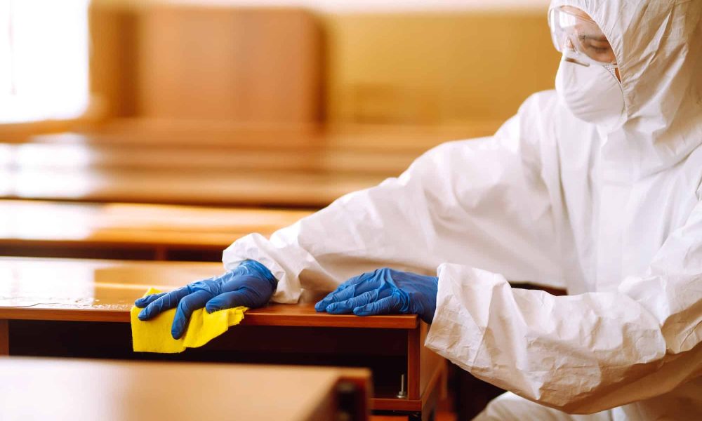 Cleaning and disinfection school desk during coronavirus pandemic. COVID-19.
