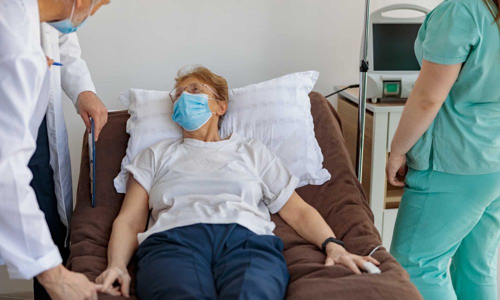 Doctors visits the patient in the ward during the procedure in hospital